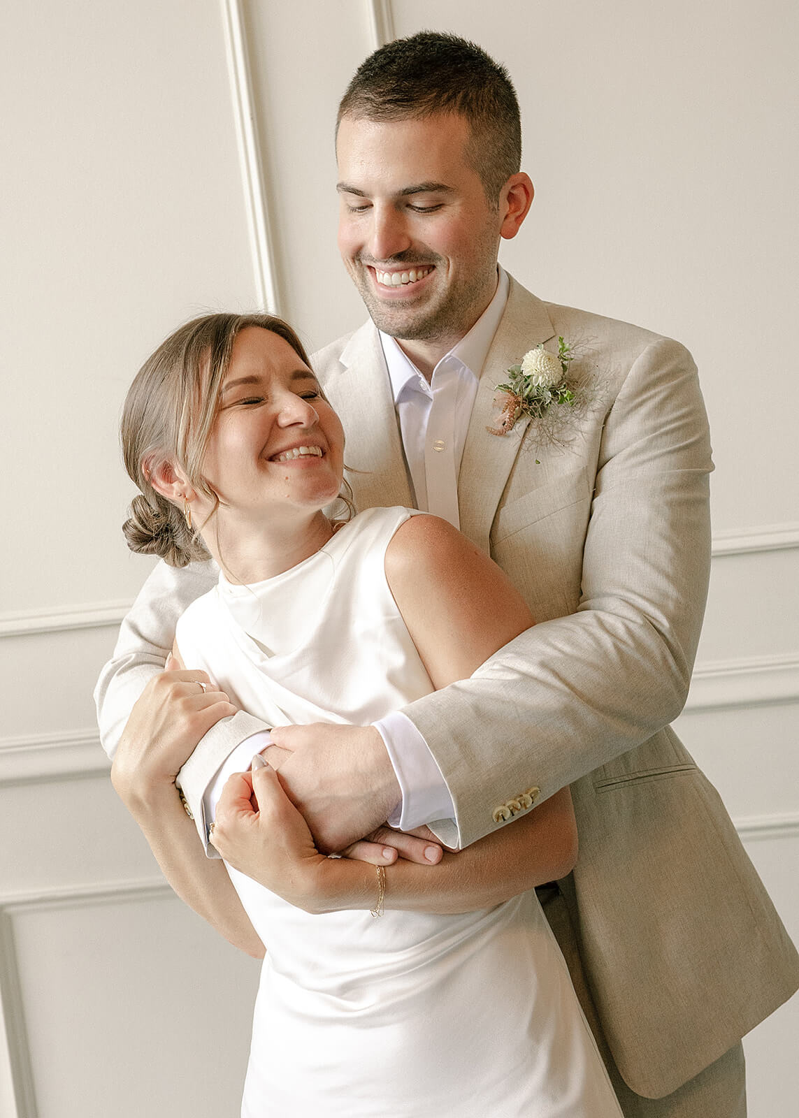 Close-up of bride and groom embracing during their Portland wedding at Tendue
