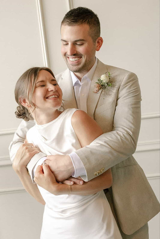 Close-up of bride and groom embracing during their Portland wedding at Tendue
