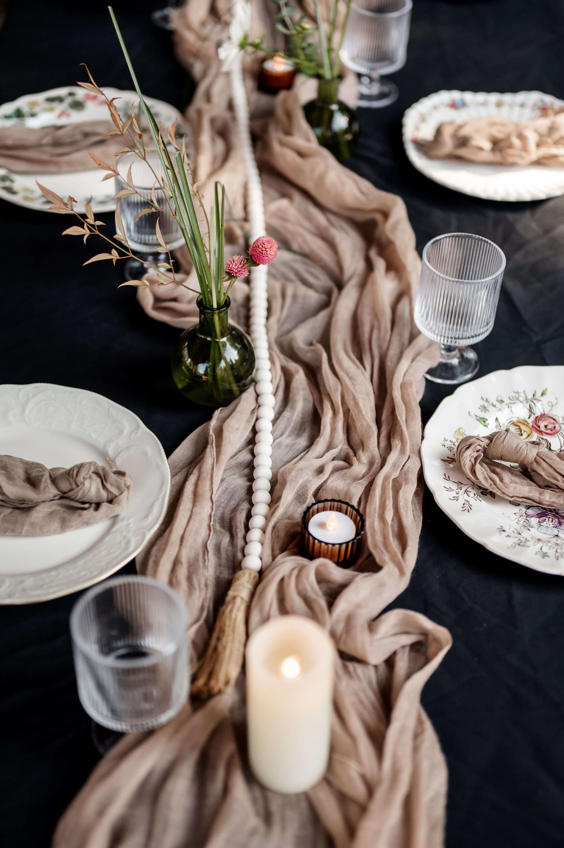 Bud vases with fall flowers and candlelight on rustic wedding table — cozy outdoor reception by Kvetka Flower, Oregon