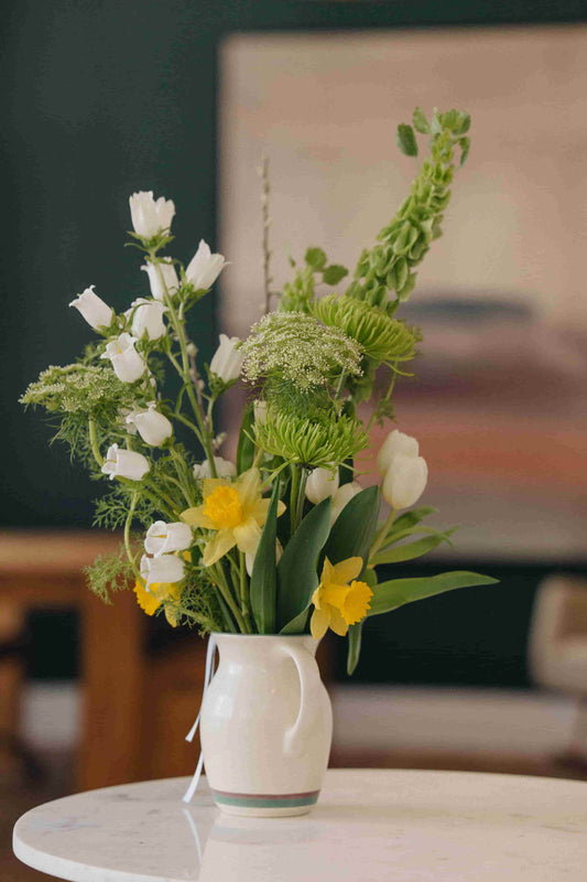 Deluxe flower subscription bouquet with daffodils, tulips, and Queen Anne's lace in a ceramic pitcher – Kvetka Flower Portland OR