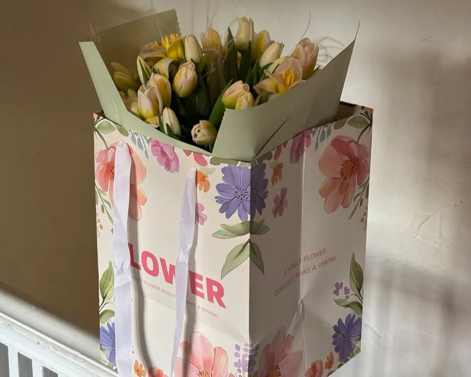 Eco-friendly flower delivery packaging with paper bag and tulips — Kvetka Flower in Portland, OR.