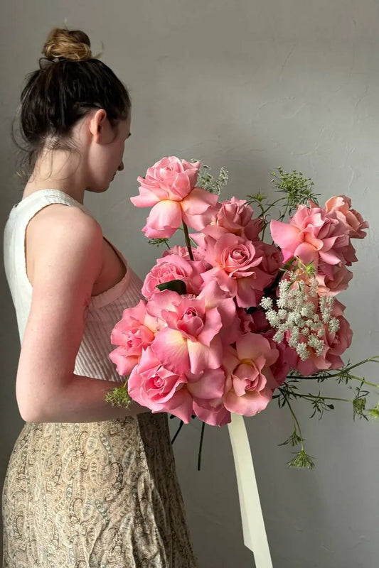 Large long stem pink rose bouquet with delicate Queen Anne's Lace hand-designed by Portland florist Kvetka Flower
