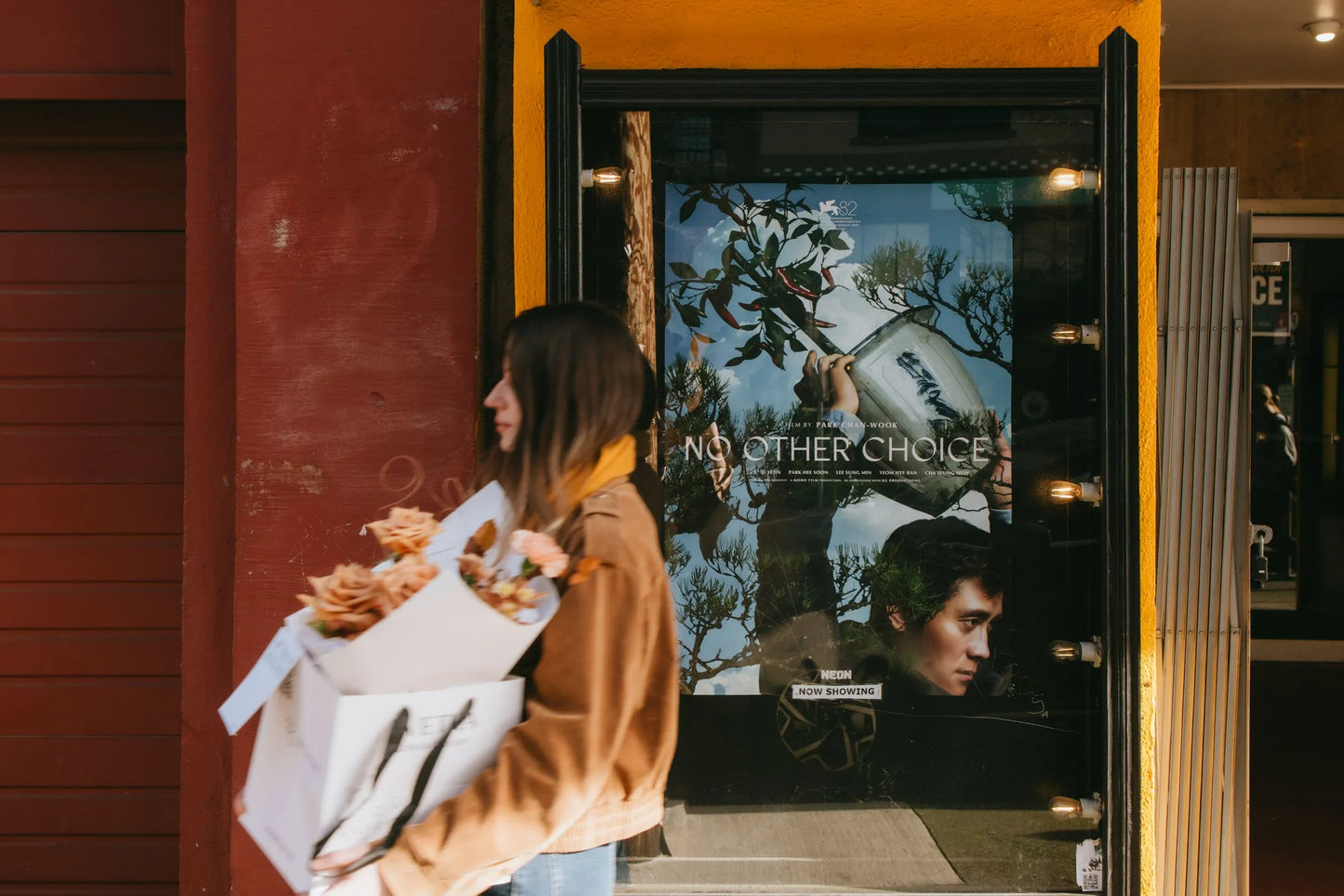 Woman walking with premium beige roses bouquet in downtown Portland