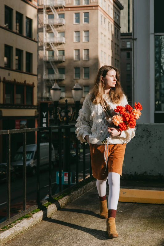 Woman holding premium bright roses bouquet in Portland