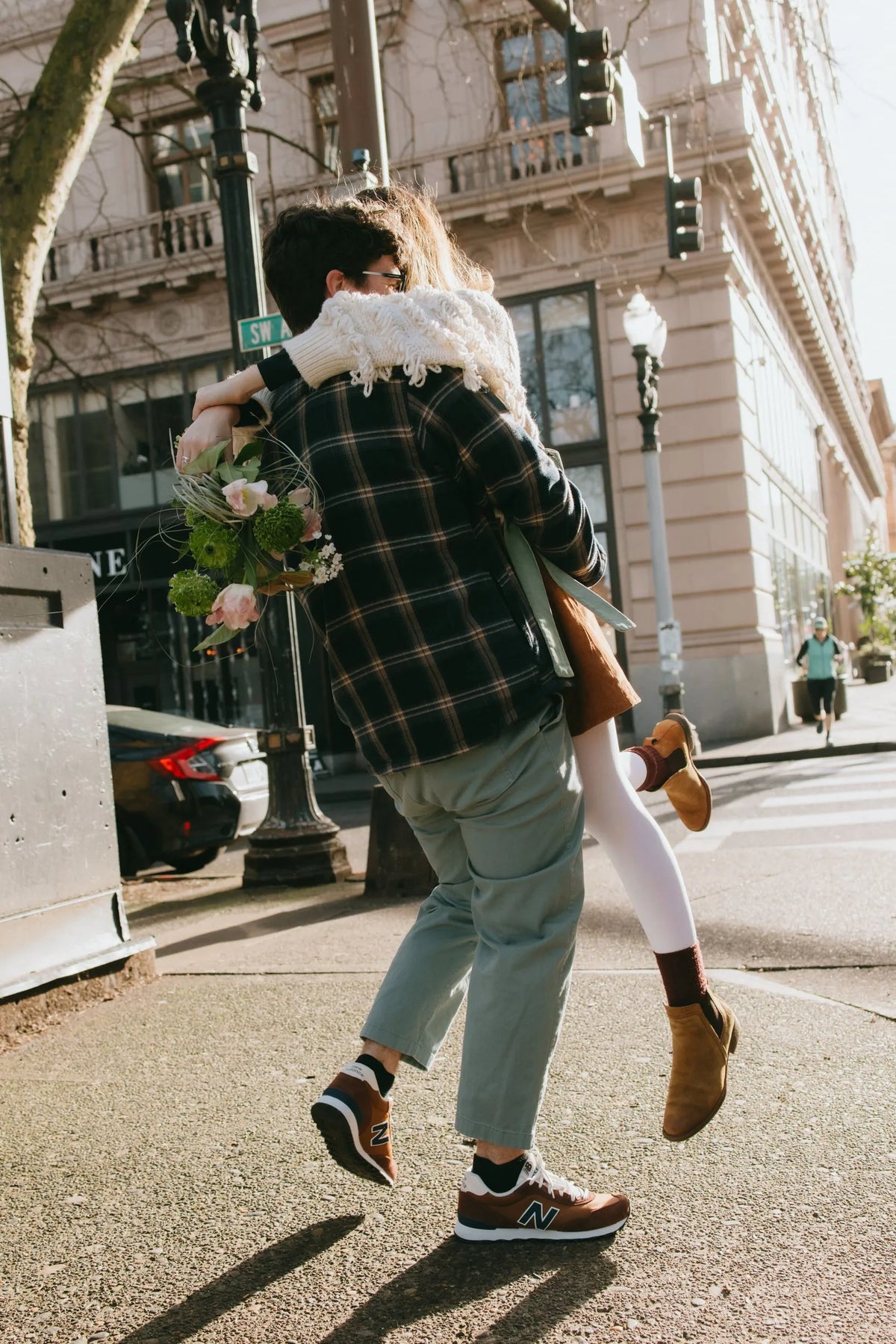 Couple with wild bouquet on downtown street