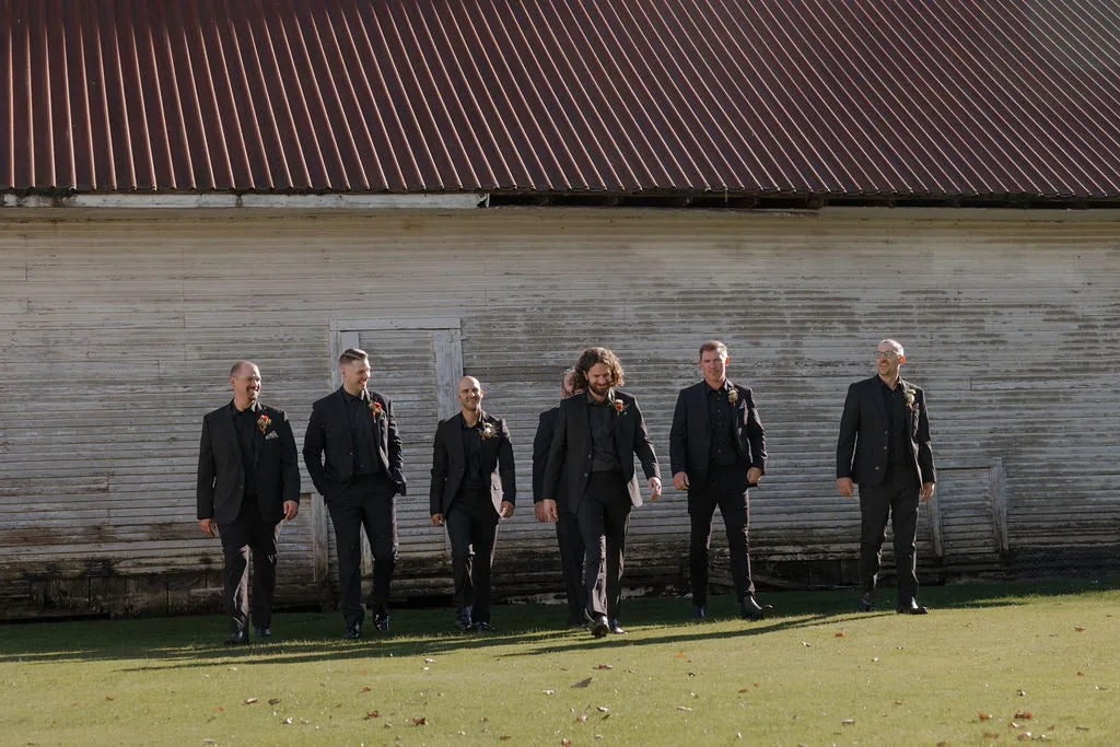 Groomsmen style for a barn wedding in Oregon standing in front of the Red Shed.