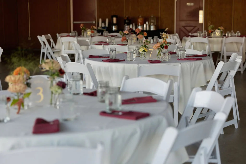 Rustic barn wedding reception inside the Red Shed at Langdon Farms with floral decor.
