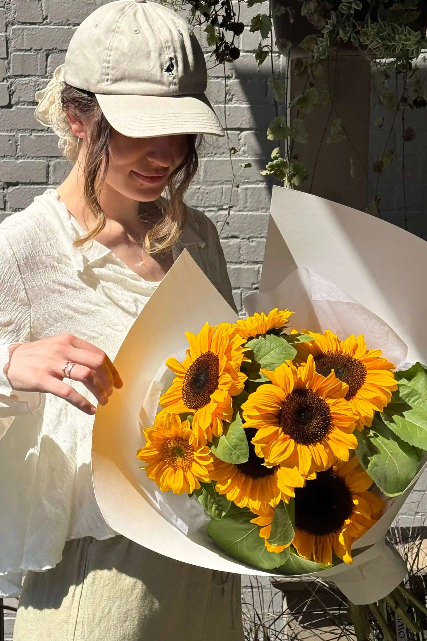 Overhead shot of Sun Day bouquet featuring fresh local sunflowers, small size, Kvetka Flower Portland OR