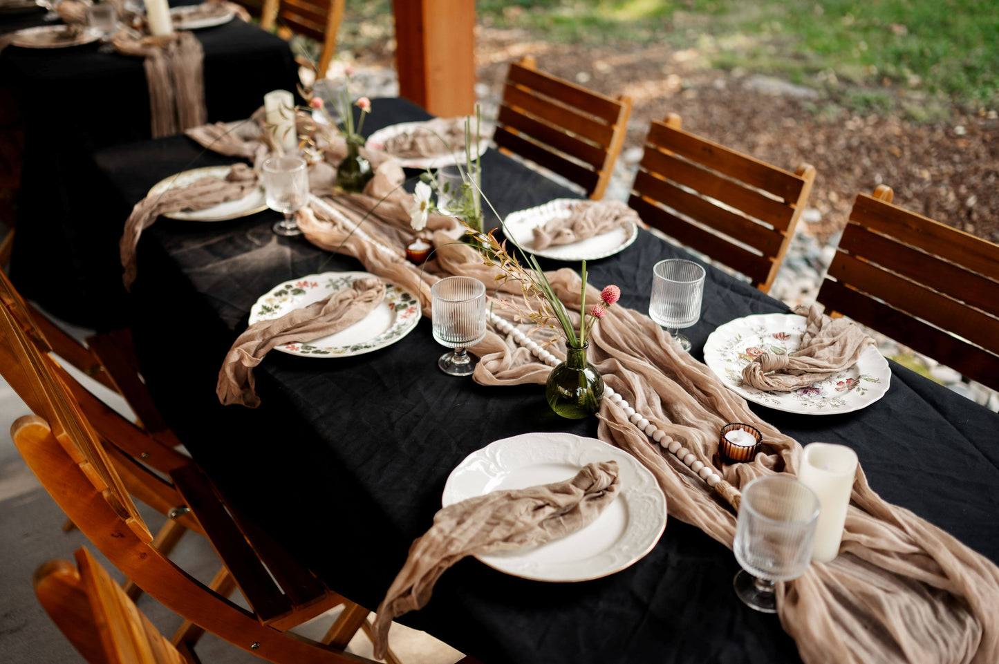 Fall wedding table with black linen, bud vases, beige gauze runner, and vintage china — Kvetka Flower Portland