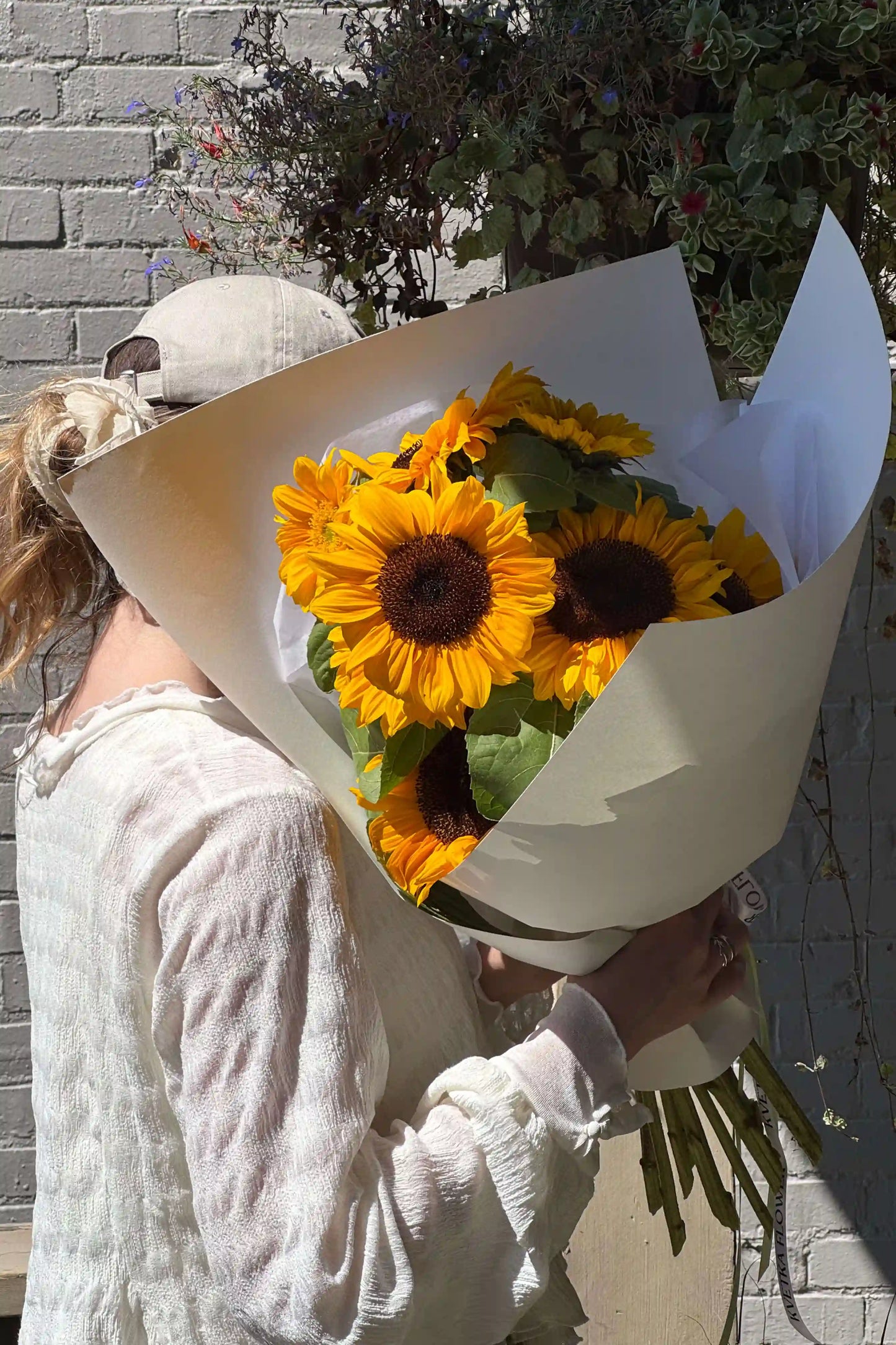 Close-up of the Sun Day bouquet with bright yellow sunflowers and natural stems – small size, hand-tied by Kvetka Flower in Portland