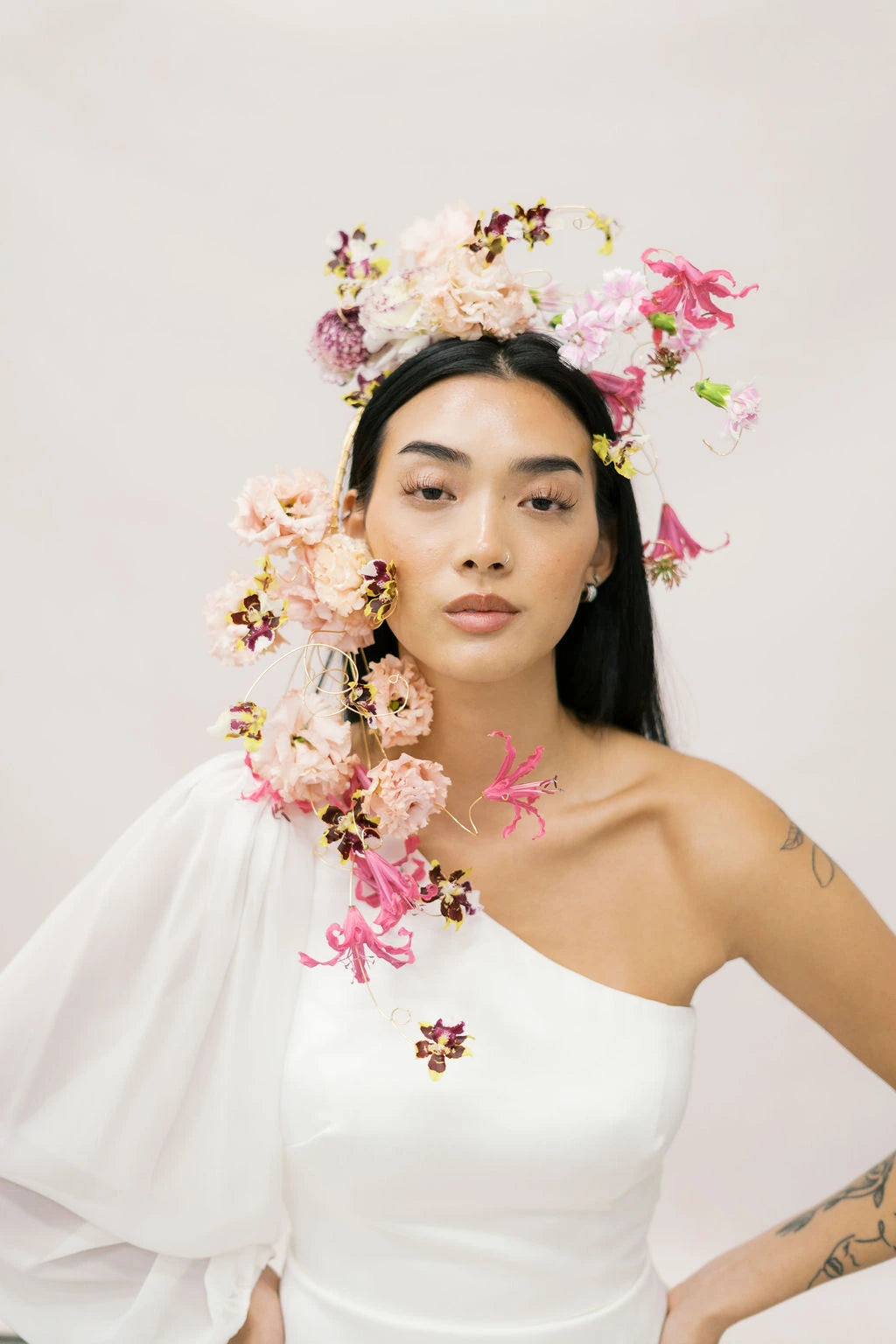 Avant-garde bridal headpiece with blush lisianthus and pink nerine on wire frame by Portland florist Kvetka Flower