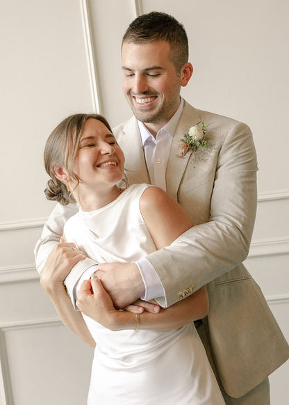 Close-up of bride and groom embracing during their Portland wedding at Tendue