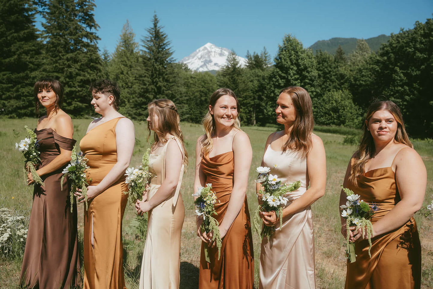 Group of bridesmaids with matching floral bouquets designed by Kvetka Flower Portland OR