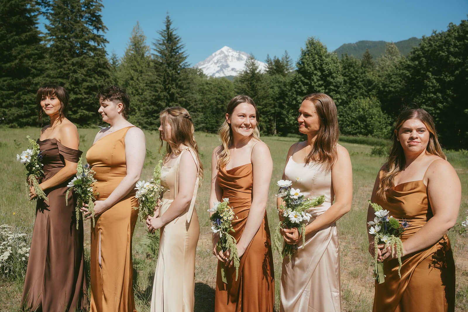 Group of bridesmaids with matching floral bouquets designed by Kvetka Flower Portland OR