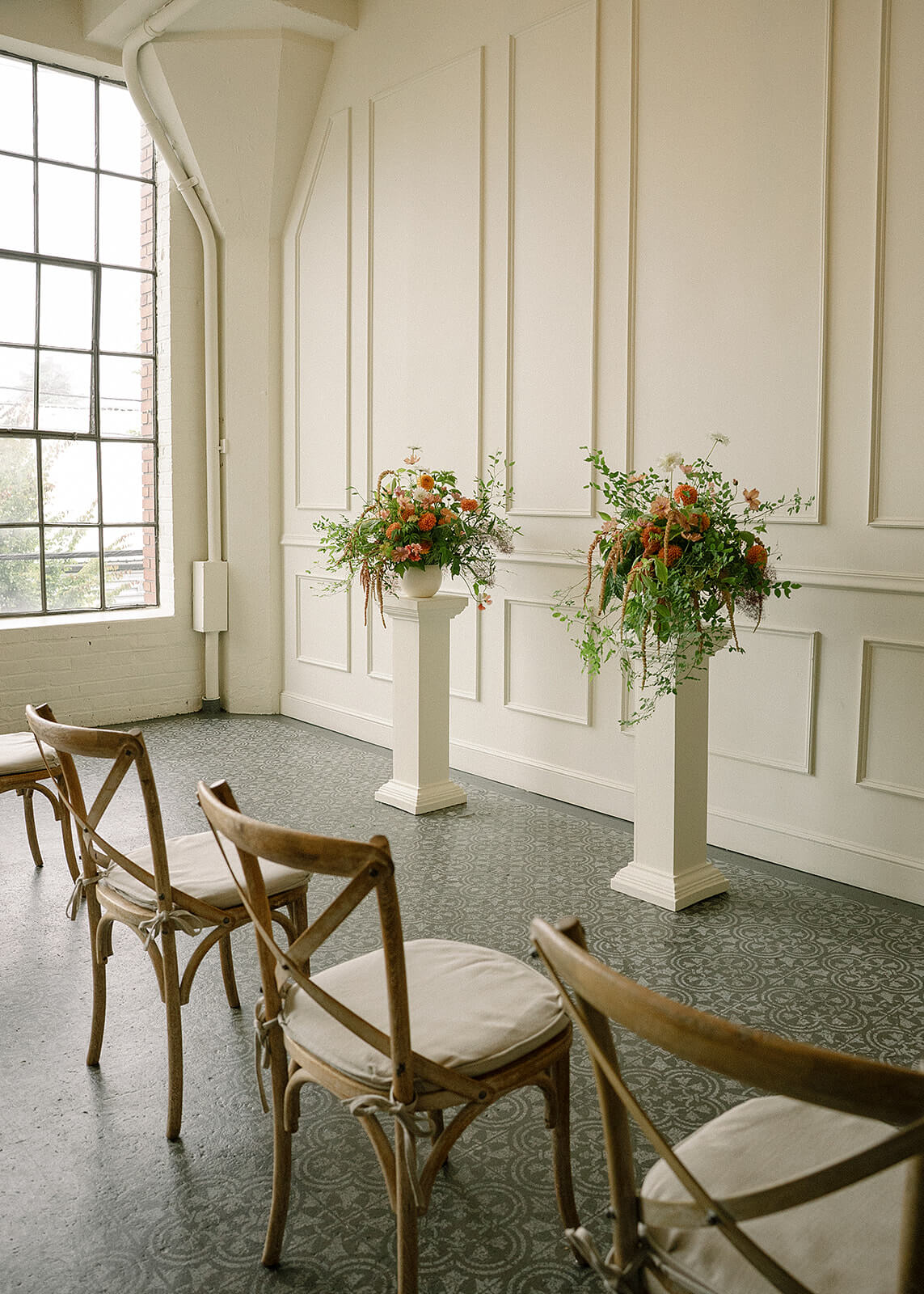 Close-up of floral ceremony arrangement with dahlias, amaranth, and greenery at Tendue Portland