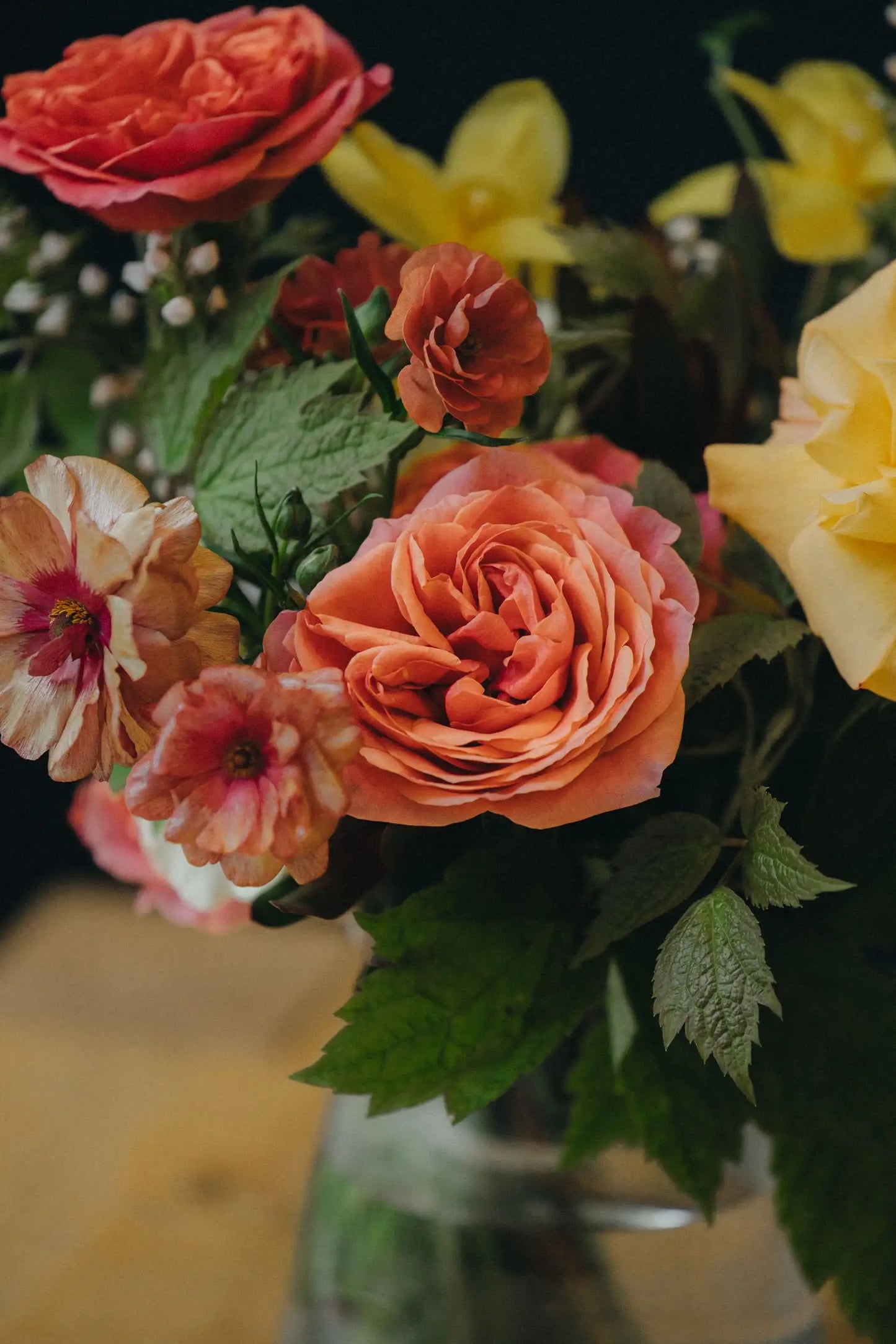 Large custom bouquet close-up coral garden rose and ranunculus hand-arranged by Portland florist Kvetka Flower