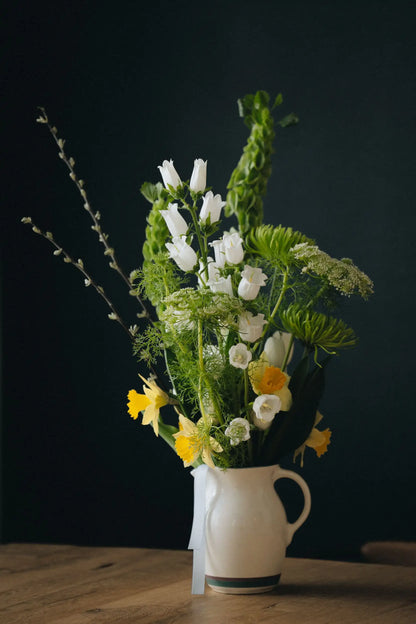 Custom designed medium flower bouquet with willow branches daffodils and white tulips Portland delivery Kvetka Flower