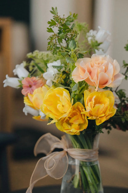 Small custom bouquet close-up yellow tulips and peach roses hand-arranged by Portland florist Kvetka Flower