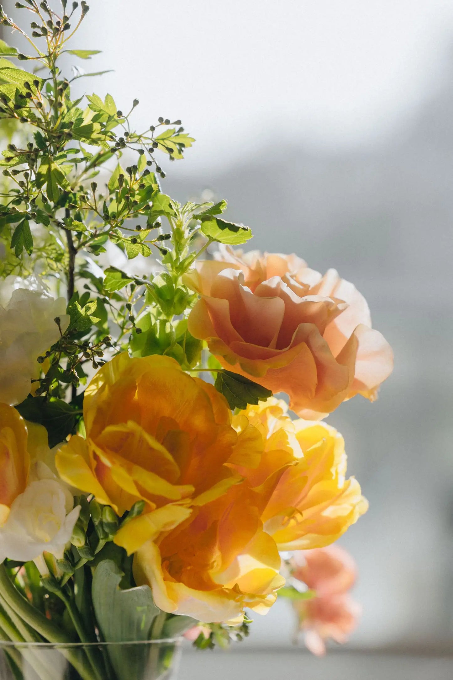Unique custom bouquet detail yellow tulips and peach garden rose by Portland florist Kvetka Flower