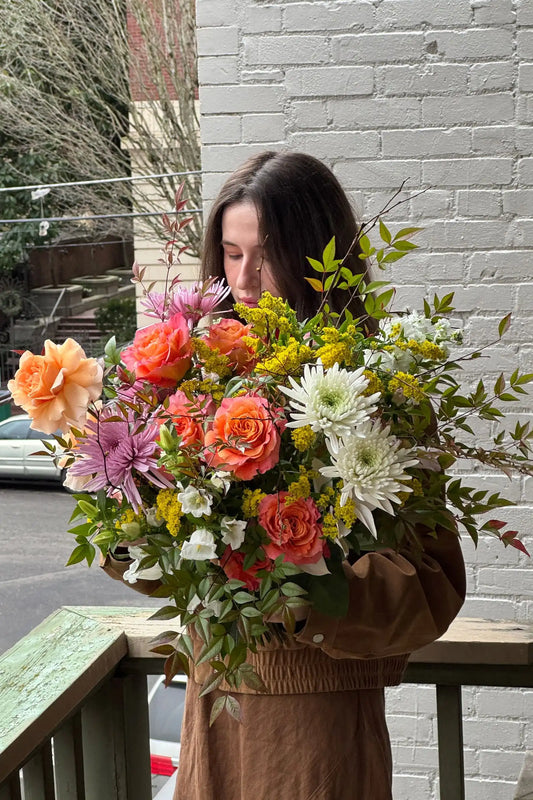 Large seasonal bouquet with orange roses and seasonal blooms Portland Oregon Kvetka Flower same-day delivery