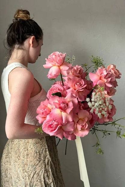 Large long stem pink rose bouquet with delicate Queen Anne's Lace hand-designed by Portland florist Kvetka Flower