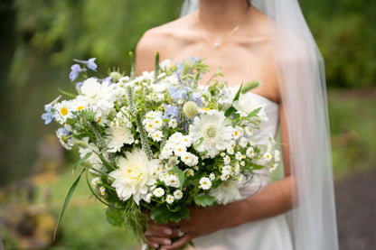 Close-up of a Kvetka Flower wedding bouquet with white daisies and soft greenery in Portland, OR
