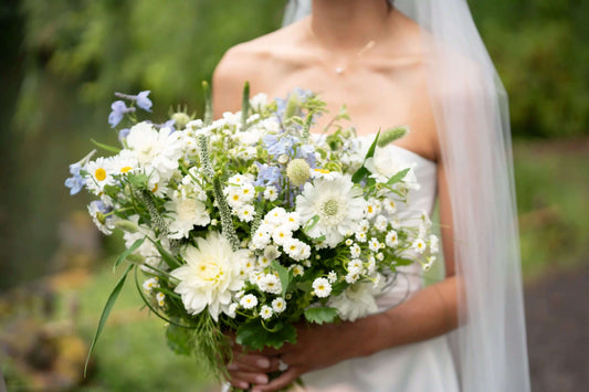Close-up of a Kvetka Flower wedding bouquet with white daisies and soft greenery in Portland, OR