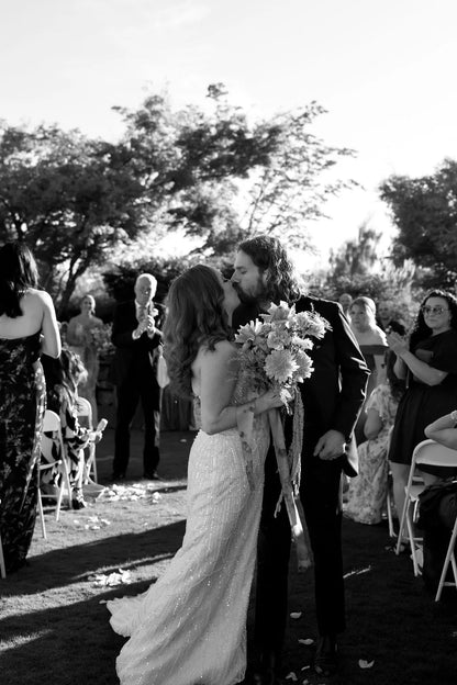 Happy couple walking down the aisle after wedding ceremony at Langdon Farms.