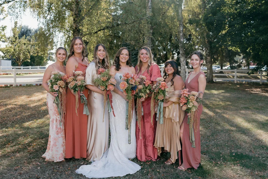 Bride and bridesmaids holding matching fall bouquets at Langdon Farms wedding, Portland florist Kvetka Flower