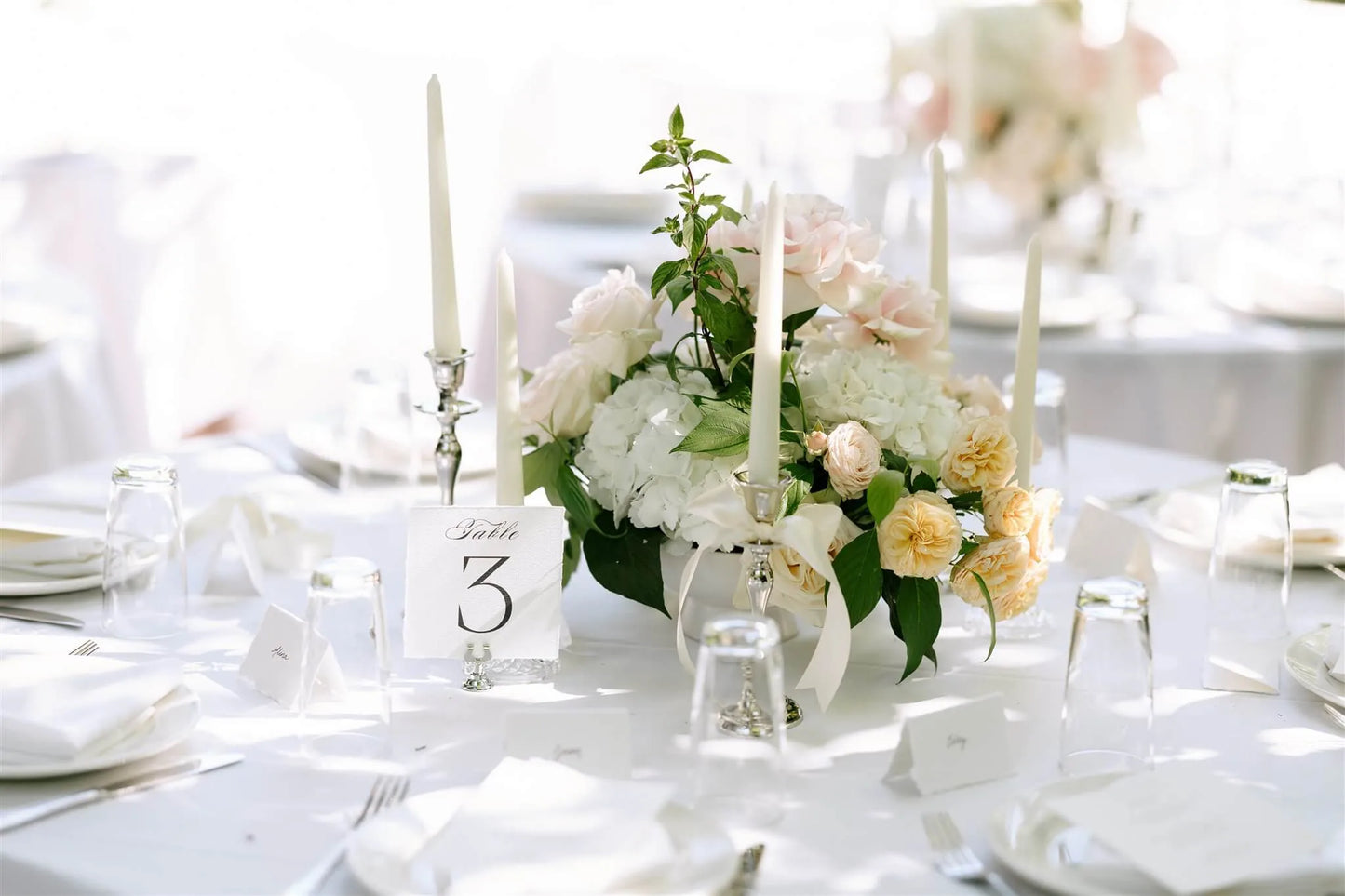 Elegant table centerpiece with garden roses and hydrangea with table number by Kvetka Flower Portland wedding