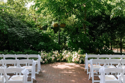 Wedding ceremony setup with lush ground meadow-style floral installations by Kvetka Flower at McMenamins Edgefield