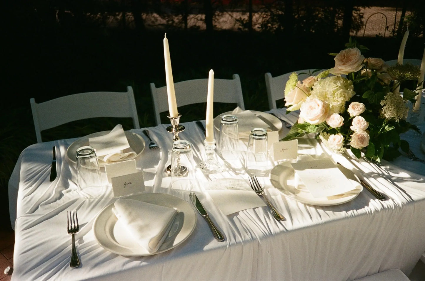 Elegant guest table setting with blush rose and hydrangea centerpiece by Kvetka Flower at McMenamins Edgefield wedding