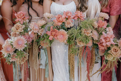 September bridal party bouquets with peach chrysanthemums, Barista roses, and trailing amaranthus by Kvetka Flower