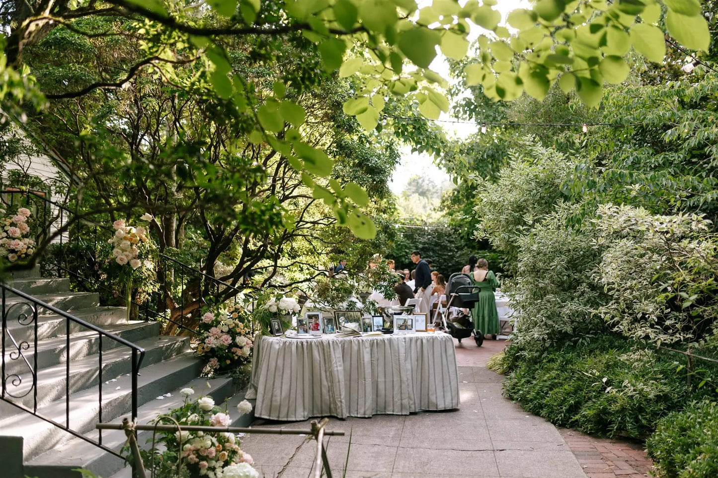 Garden venue staircase decorated with climbing rose arrangements by Kvetka Flower at McMenamins Edgefield wedding