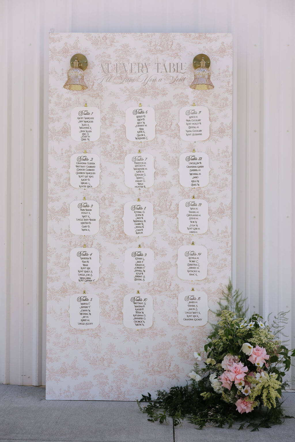 A beautiful floral arrangement by Kvetka Flower decorating the guest seating chart at a Portland wedding.