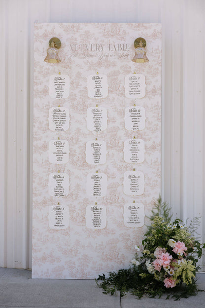 A beautiful floral arrangement by Kvetka Flower decorating the guest seating chart at a Portland wedding.