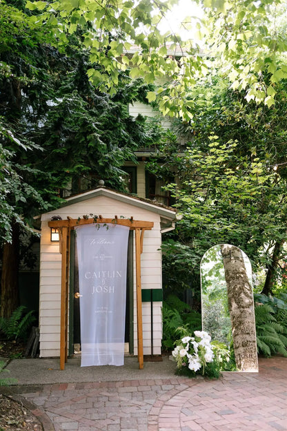 Wedding welcome sign with white floral arrangement accent at McMenamins Edgefield by Kvetka Flower Portland