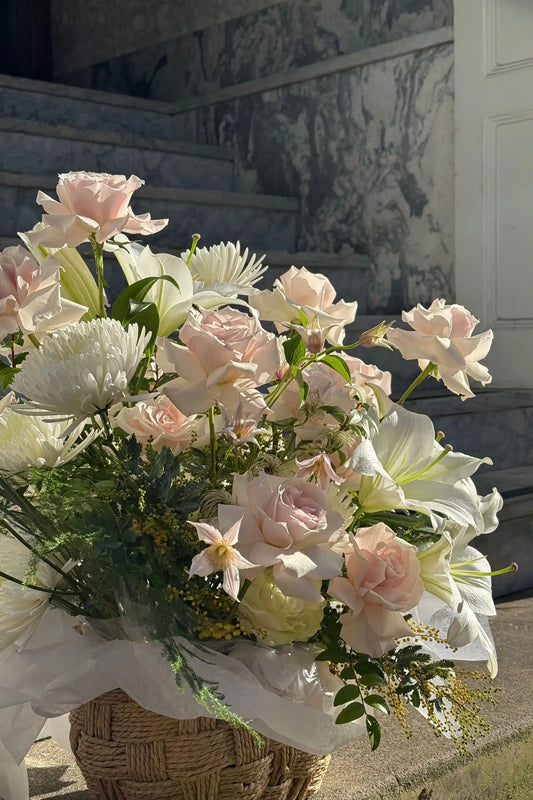 Close-up of romantic flower basket blush roses white lilies seasonal blooms Portland florist Kvetka Flower