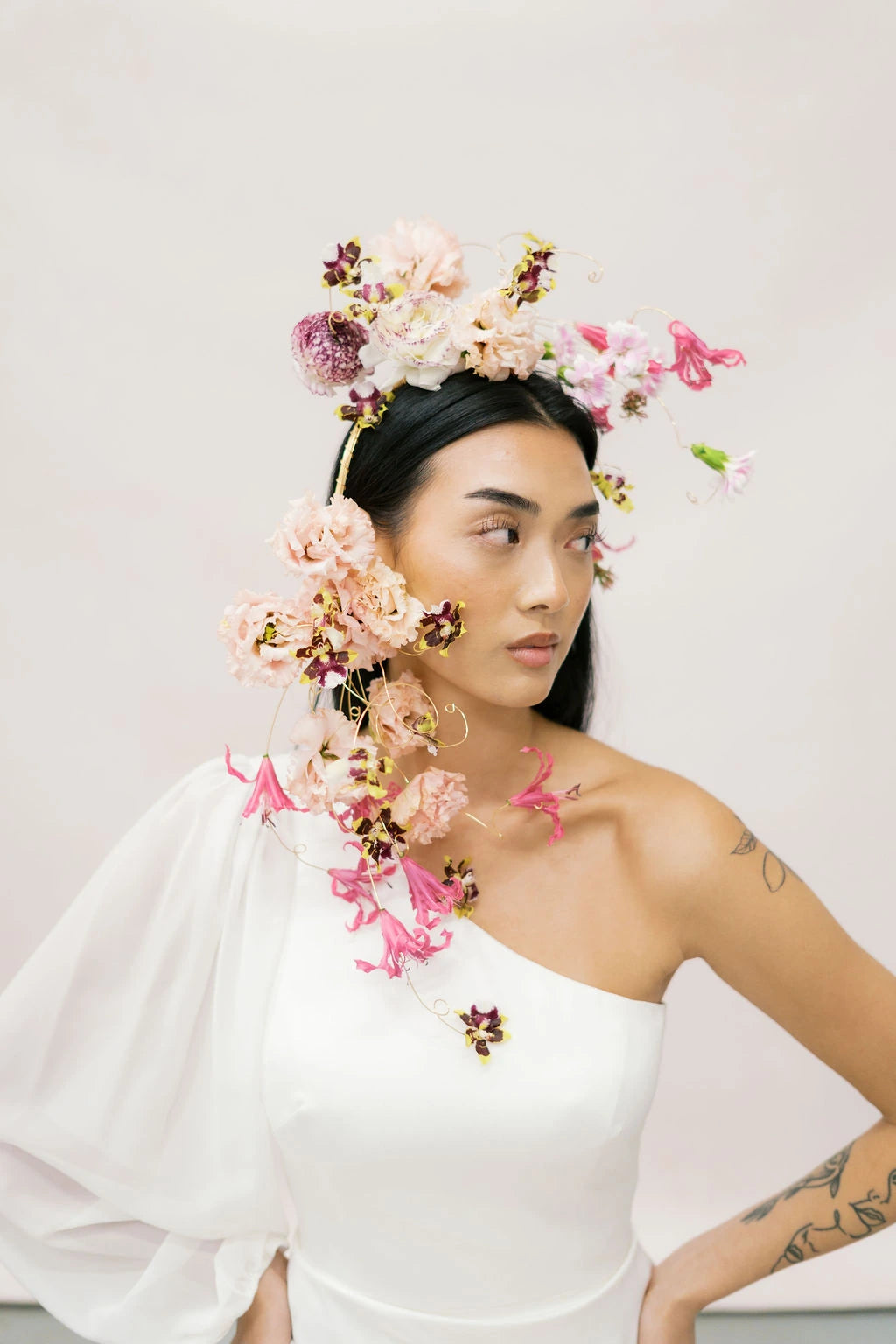 Bride profile with sculptural cascading flower crown in blush and burgundy tones Kvetka Flower Portland