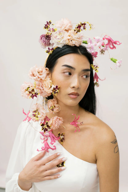 Close-up of bride with dramatic flower crown cascading past shoulder by Portland wedding florist Kvetka Flower