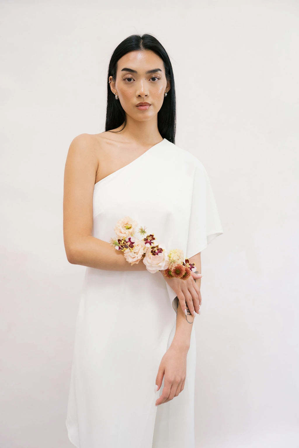 Bride portrait with avant-garde forearm corsage in blush pink and terracotta by Kvetka Flower Portland