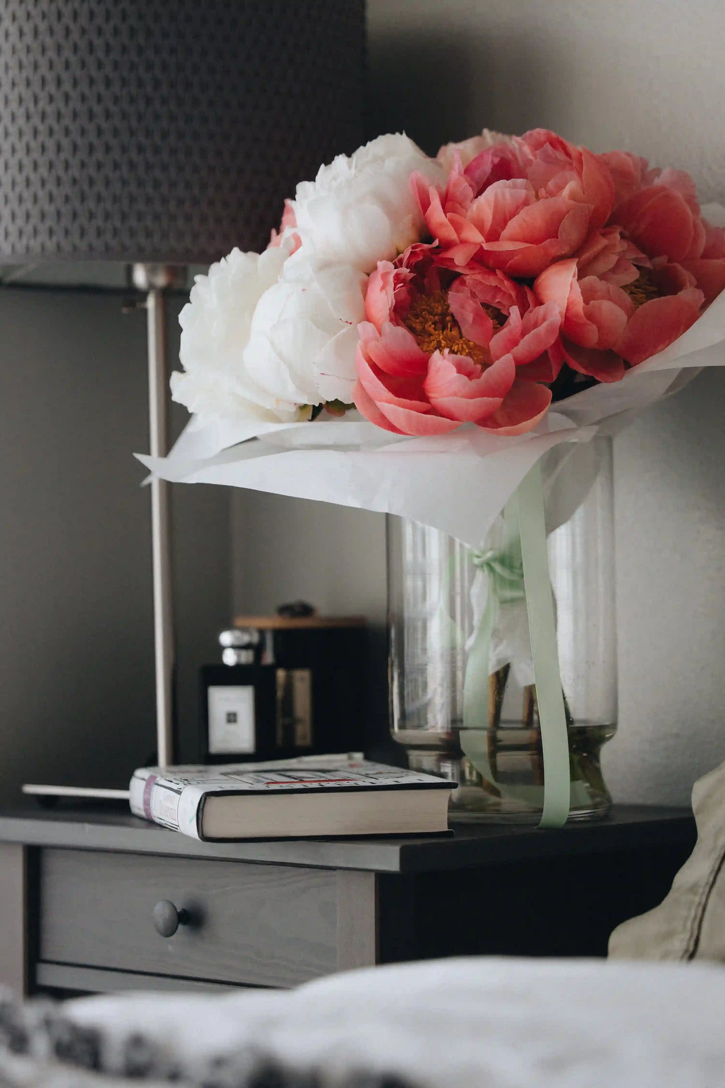 Soft blush and white peonies arranged simply in paper wrap, Kvetka Flower style